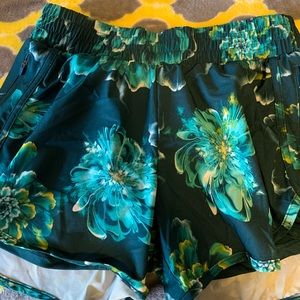 blue and green flowered athletic shorts